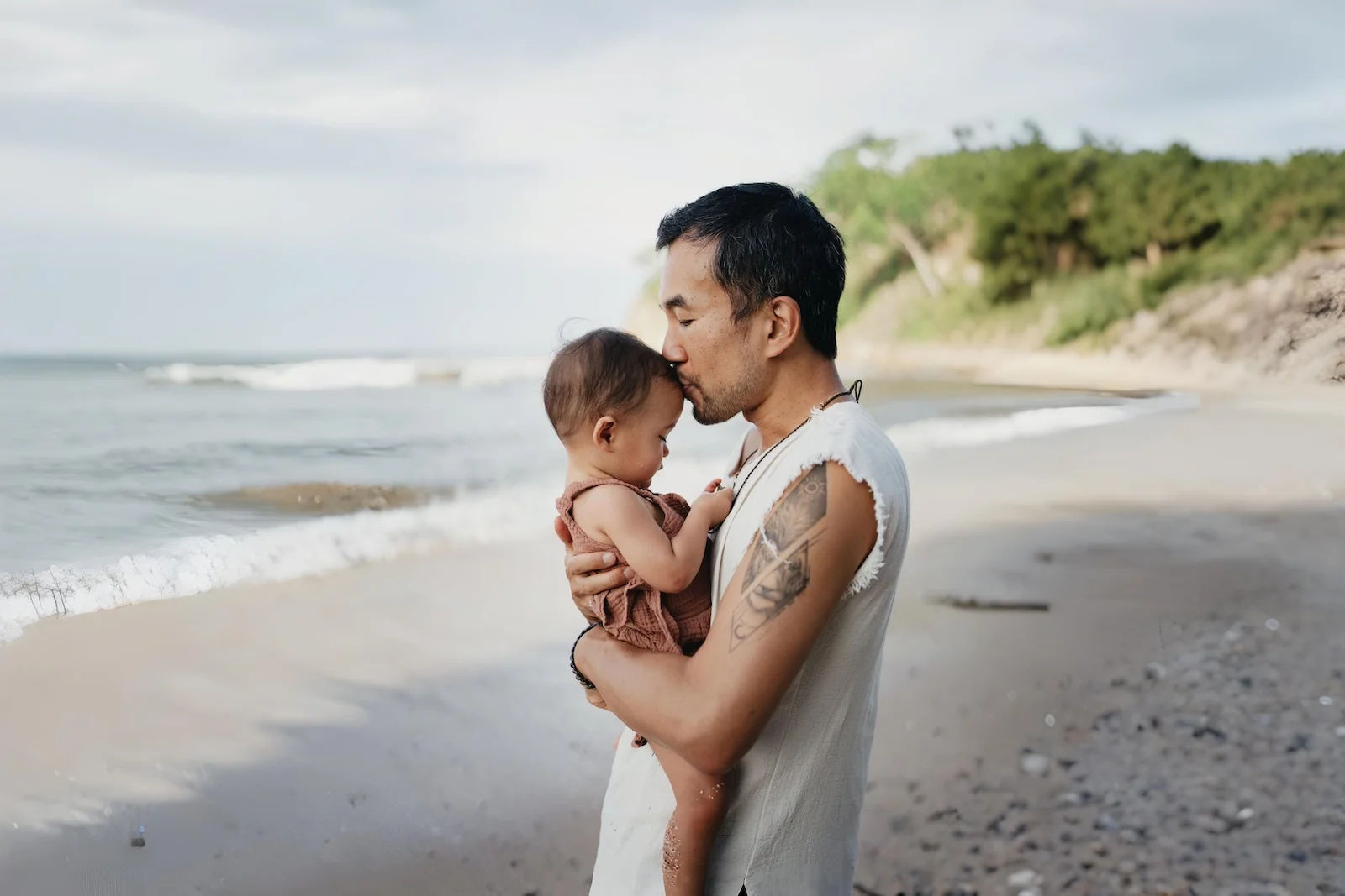Father holding daughter in tender moment