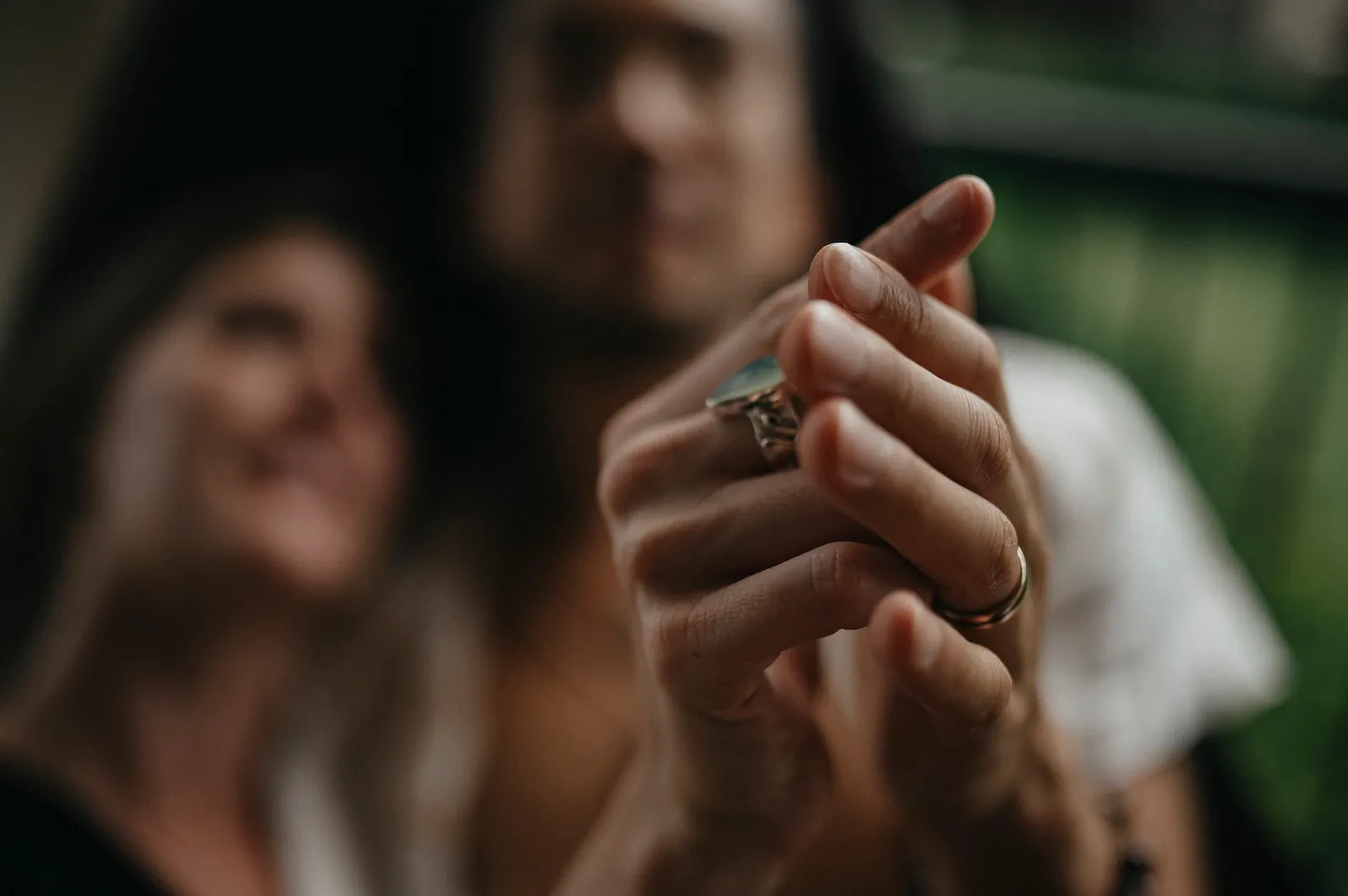 Two partners' hands meeting at the edge